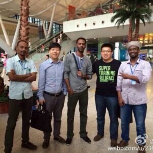XNET representatives with international customers during an overseas power exhibition
