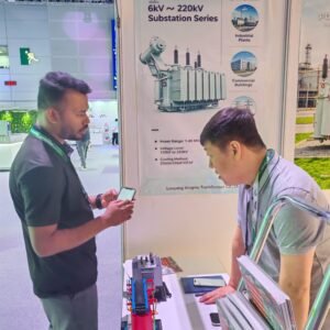 Technical discussion about XNET substation and transformer solutions at an industry exhibition