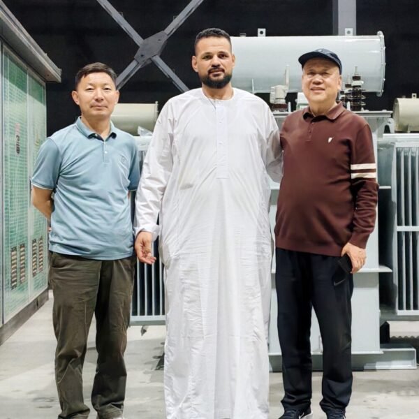International customer inspecting transformer equipment with the XNET factory team