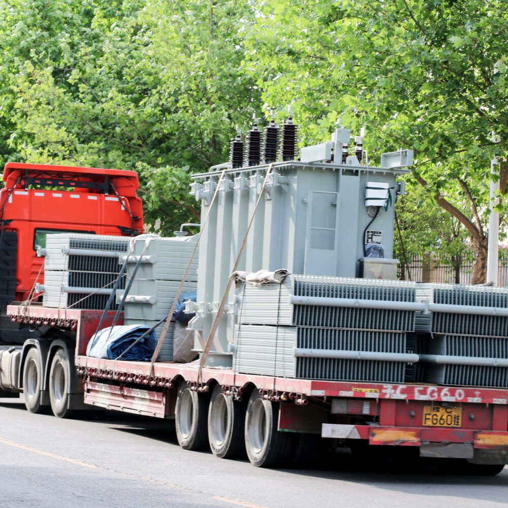 Large power transformer transported on a heavy-duty flatbed truck