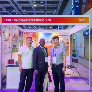 XNET team with a customer at the Henan Xingbian Electric transformer exhibition booth